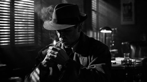 Film Noir: 1940s crime drama in hard black-and-white shadow and smoke.