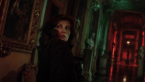 Giallo Horror: Lurid red and green gels in 1970s Italian suspense.
