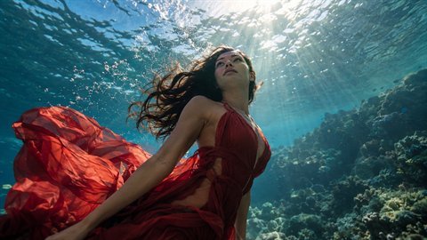 Underwater: Submerged scenes with sun rays, bubbles and weightless floating hair.